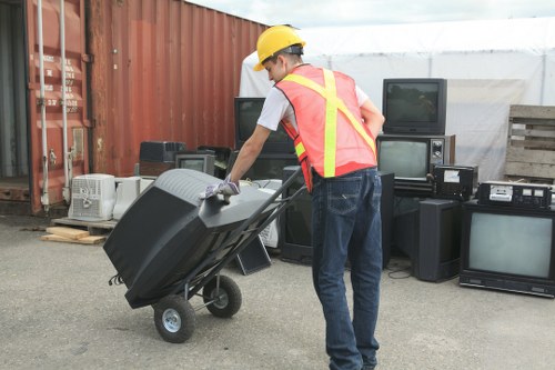 Inspector reviewing waste clearance records on a tablet